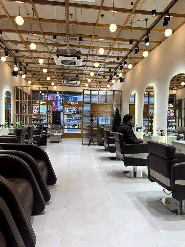 Styling stations and warm globe lighting at Essentia Salon