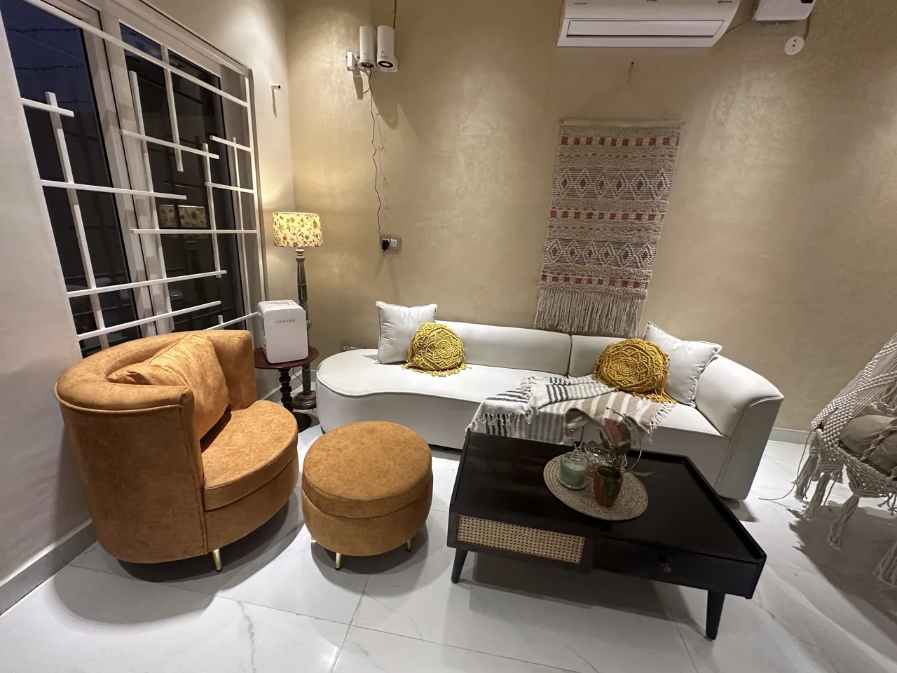 Opera Home project photograph — cream sofa and caramel accent seating