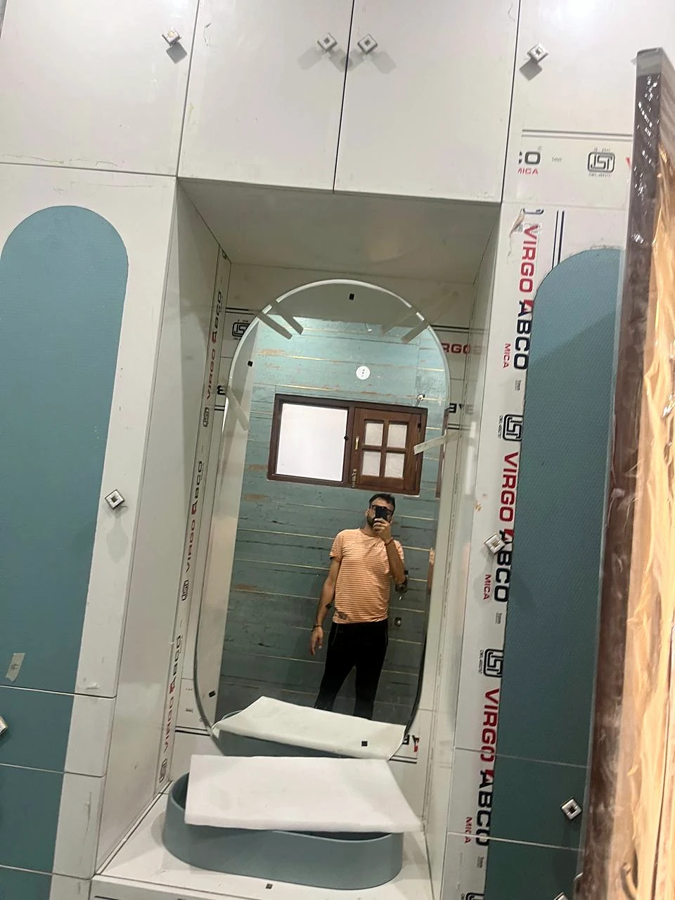 Bathroom vanity and mirror photographed during the site visit