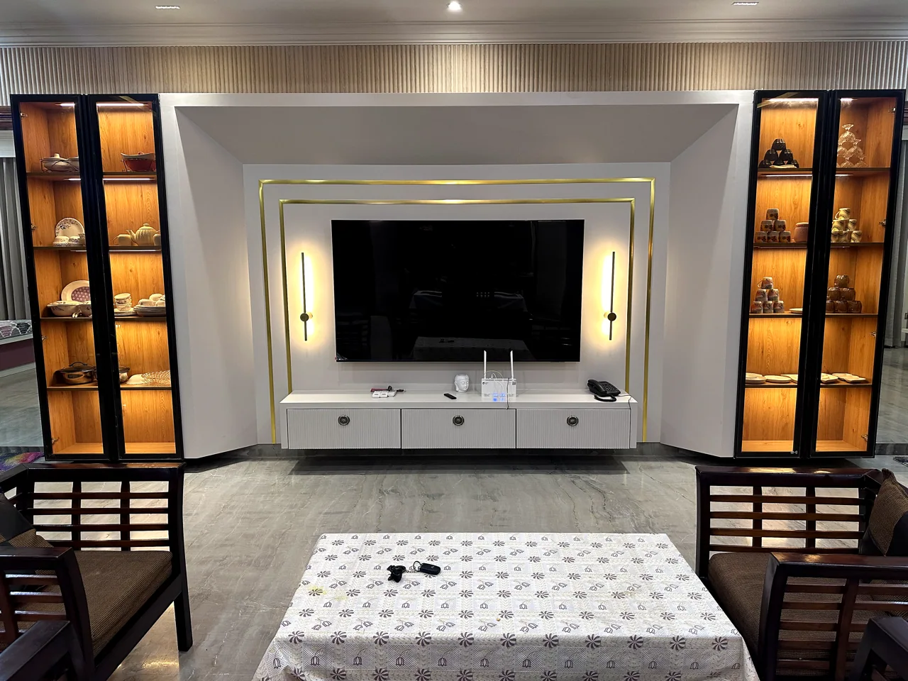 Living room with a feature media wall and integrated display shelving